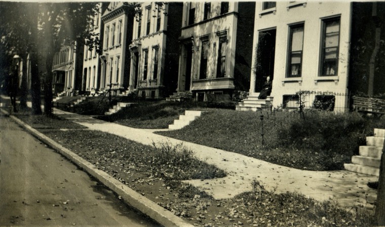 townhouse row with Grandma Sallie_c. 1920 maybe